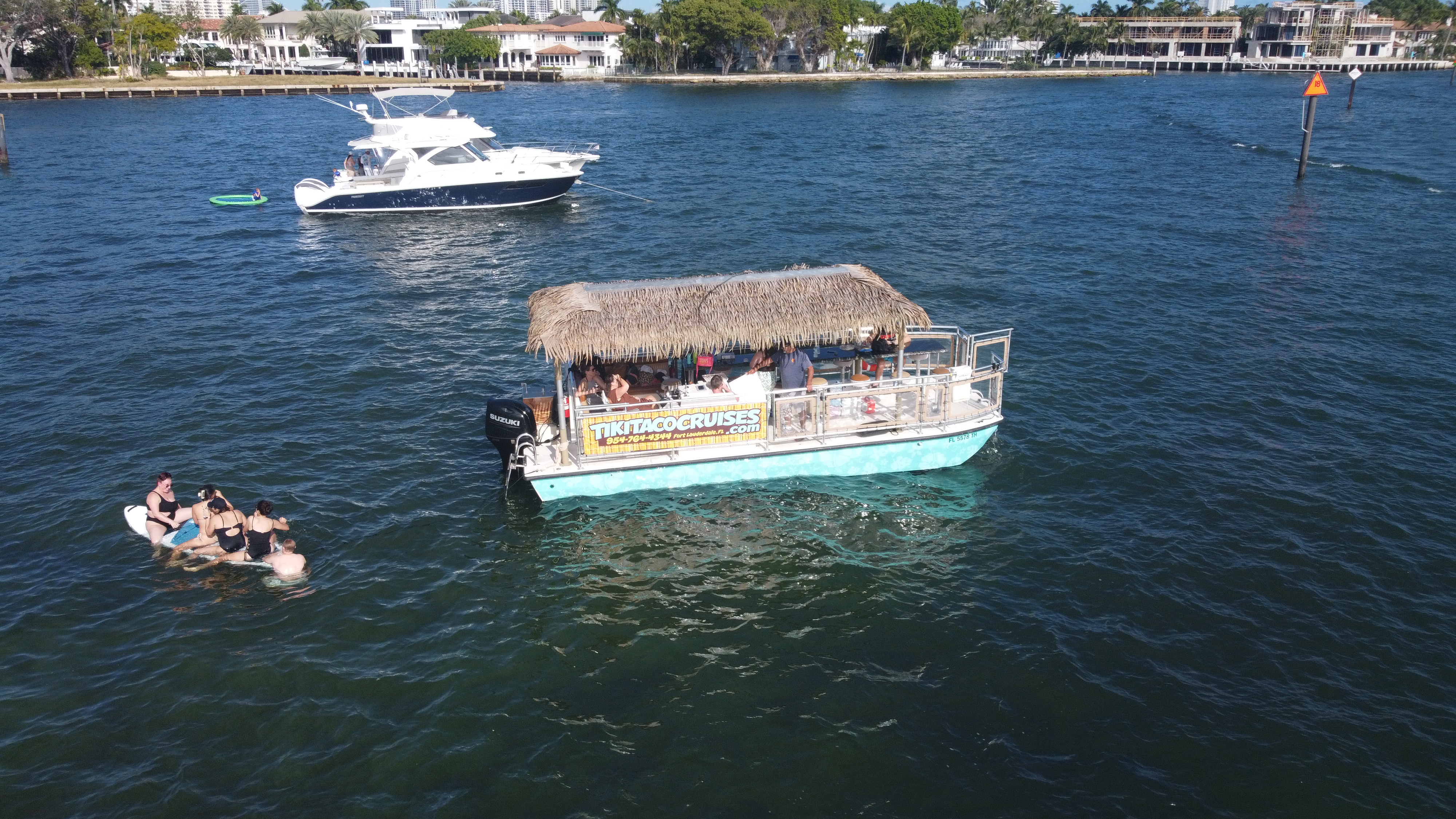 Guests enjoying a tiki pontoon cruise